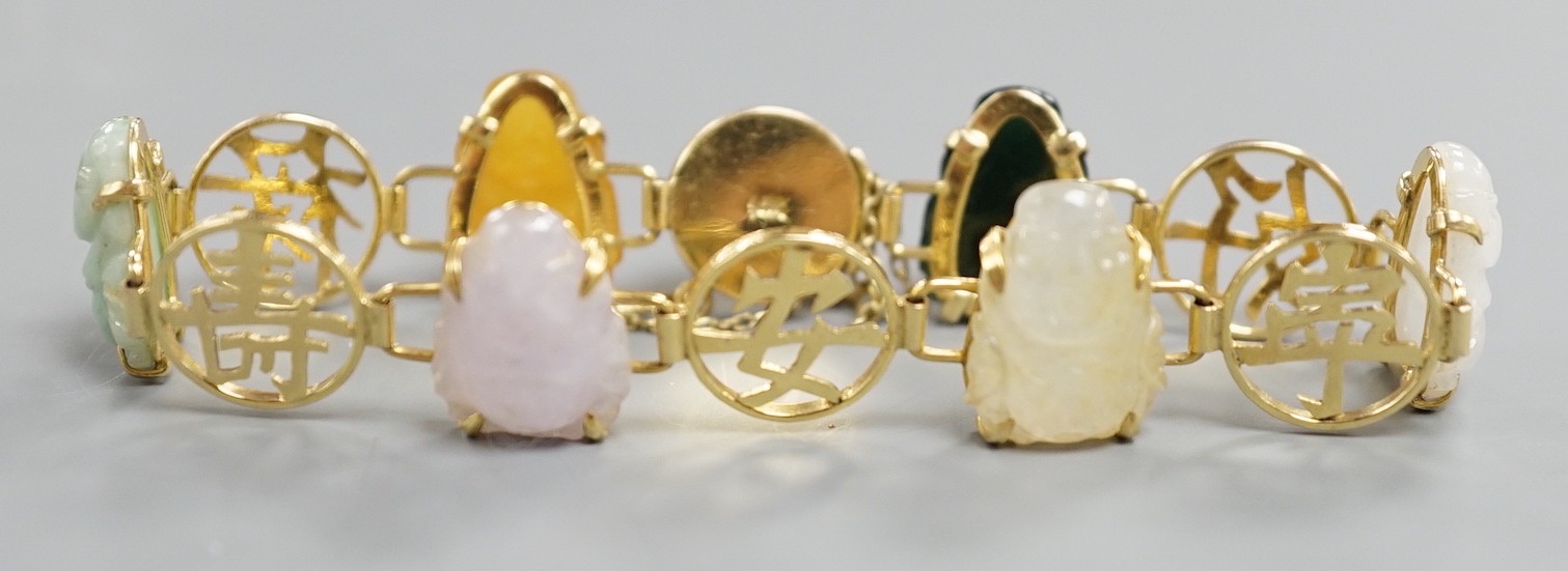 A Chinese 14k yellow metal and hardstone set bracelet, with alternating character and six carved Buddha set links, approx. 17cm, gross weight 17.3 grams.